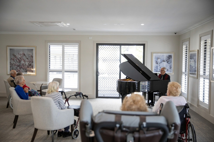 A shared lounge with a piano