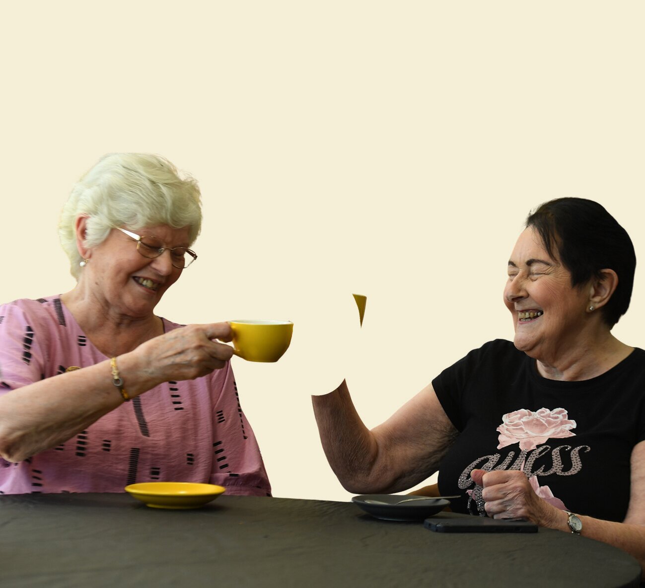 Two residents sharing a cup of tea